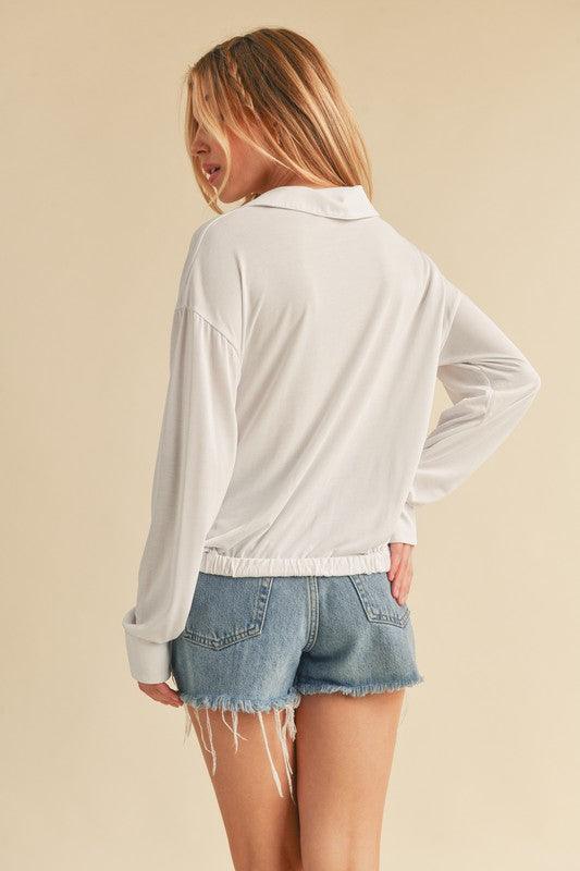 Aemi + Co Twisted Hemline Button Detail Collared Neck Top.