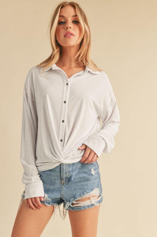Aemi + Co Twisted Hemline Button Detail Collared Neck Top.