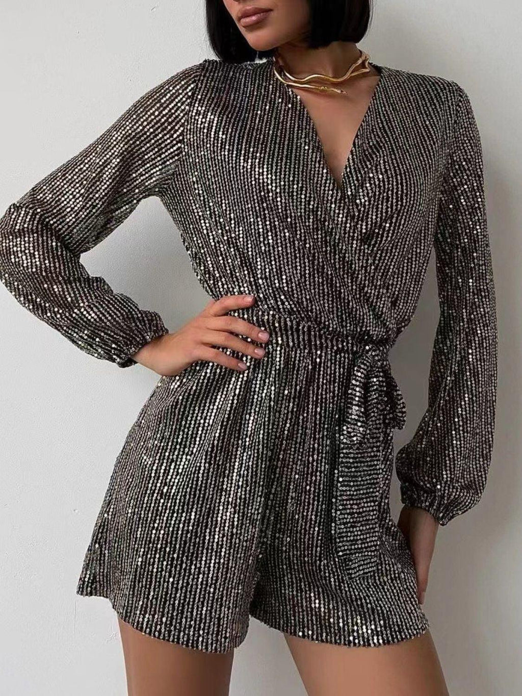 Full Size Sequin Surplice Tie Waist Long Sleeve Romper.