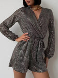 Full Size Sequin Surplice Tie Waist Long Sleeve Romper.