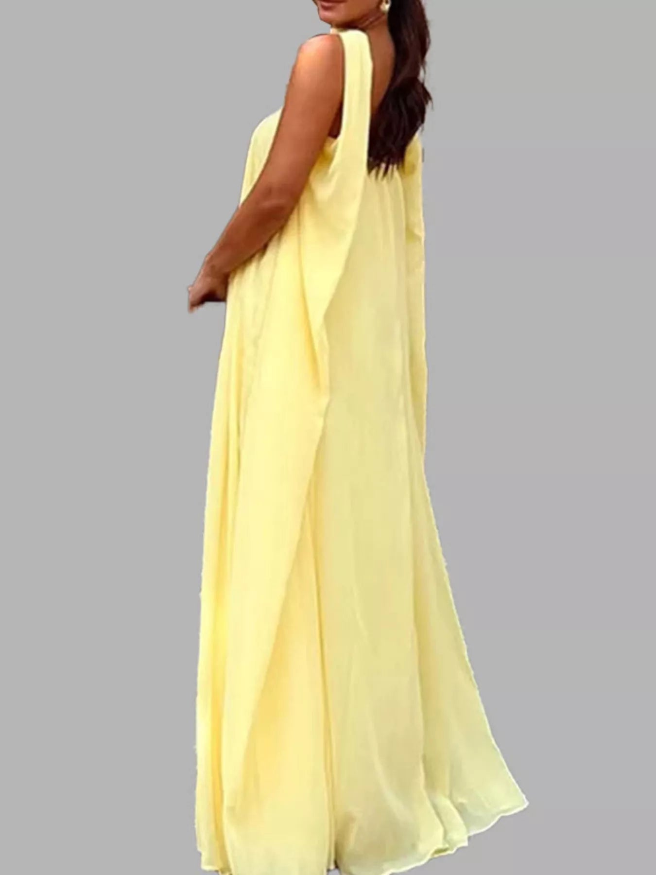 Close front view of butter yellow halter scarf neck maxi dress showing draped bodice and flowing fabric detail