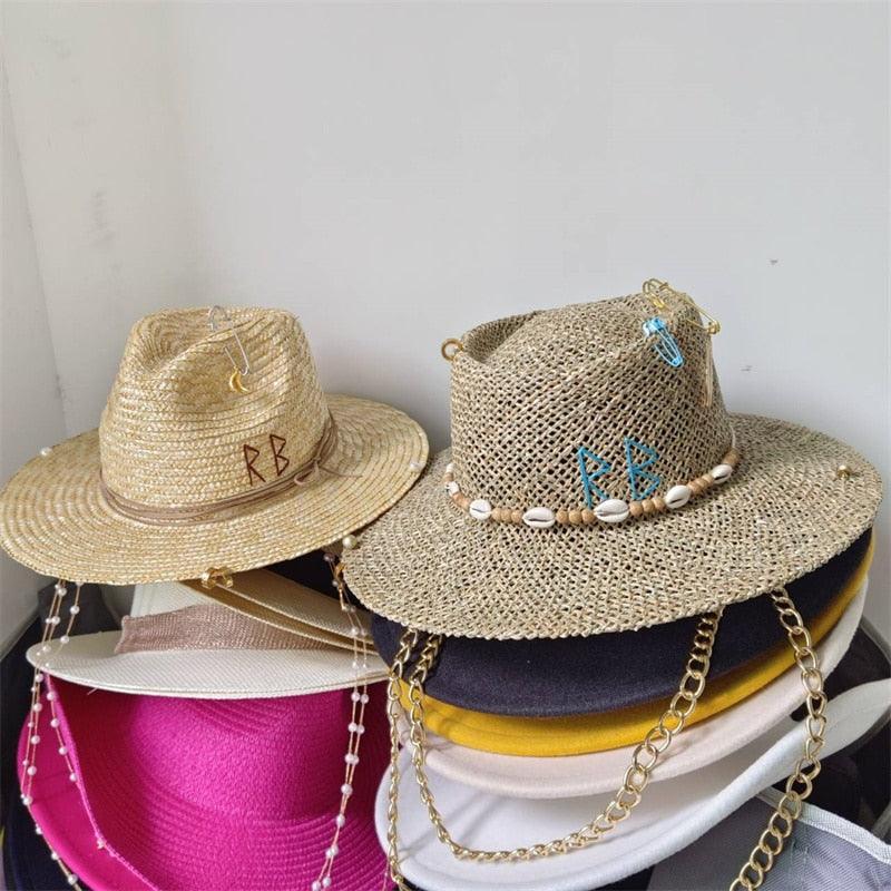 Coffee Punk Embellished Boho Straw Fedora Hat, side view showing wide brim, gold safety pin with feather charm and gold ring detail