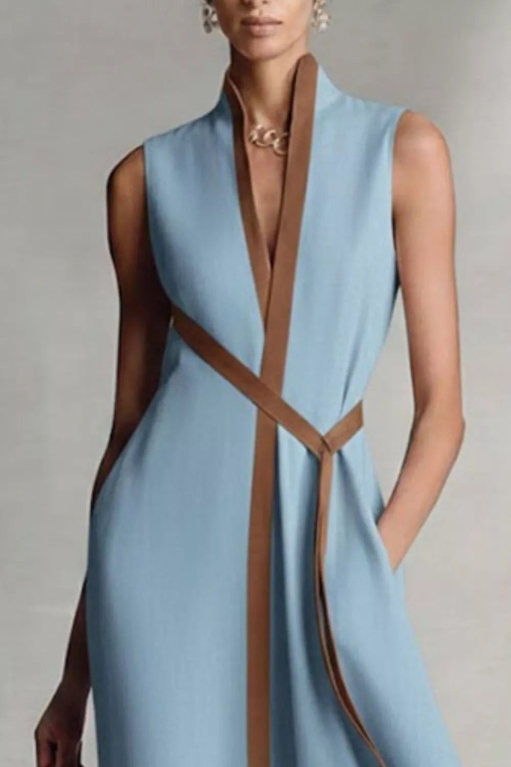 Sleeveless Belted Contrast Trim Midi Dress in dusty blue, three-quarter view showing sleeveless silhouette and belted waist