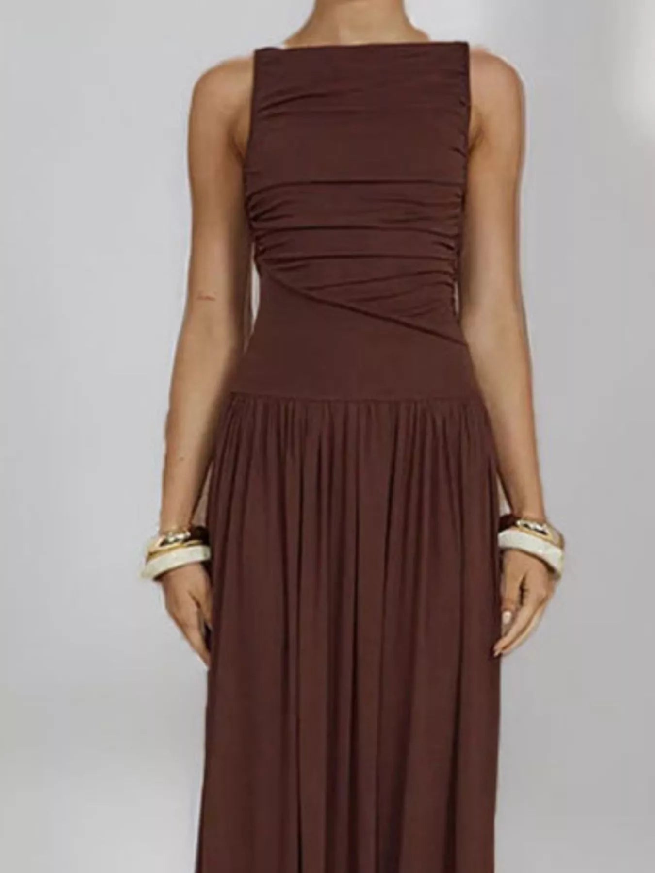 Brown ruched sleeveless maxi dress, mid-body view showing the twisted ruching across the bust and waist.