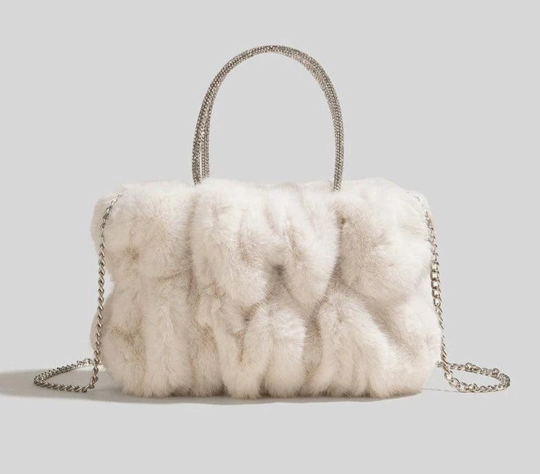 Soft Plush Faux Fur Style Crossbody Bag in Horizontal Square shape with Chain single sling with Magnetic buckle opening. Comes with gift box & gift bag.  Available in; White, Turquoise, Pink, Purple, Brown, Black. 