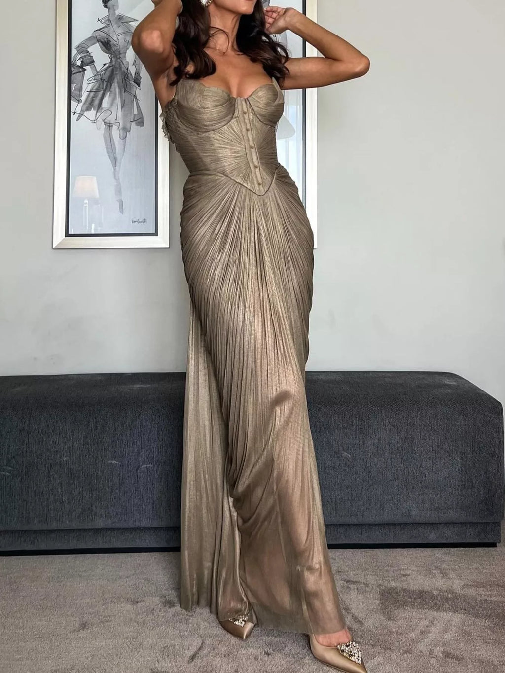 Gold Metallic Pleated Corset Maxi Dress, back view showing the lace-up back closure and the pleated skirt sweep.