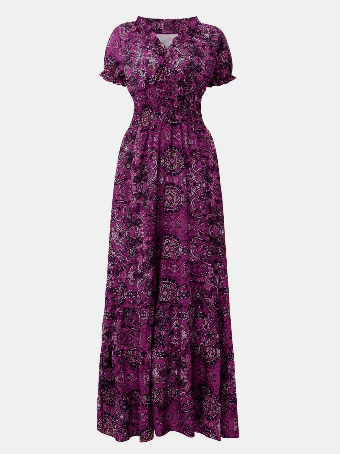 Gray paisley smocked V-neck short-sleeve maxi dress, front view showing the V-neckline, smocked bodice, and tiered floor-length skirt.