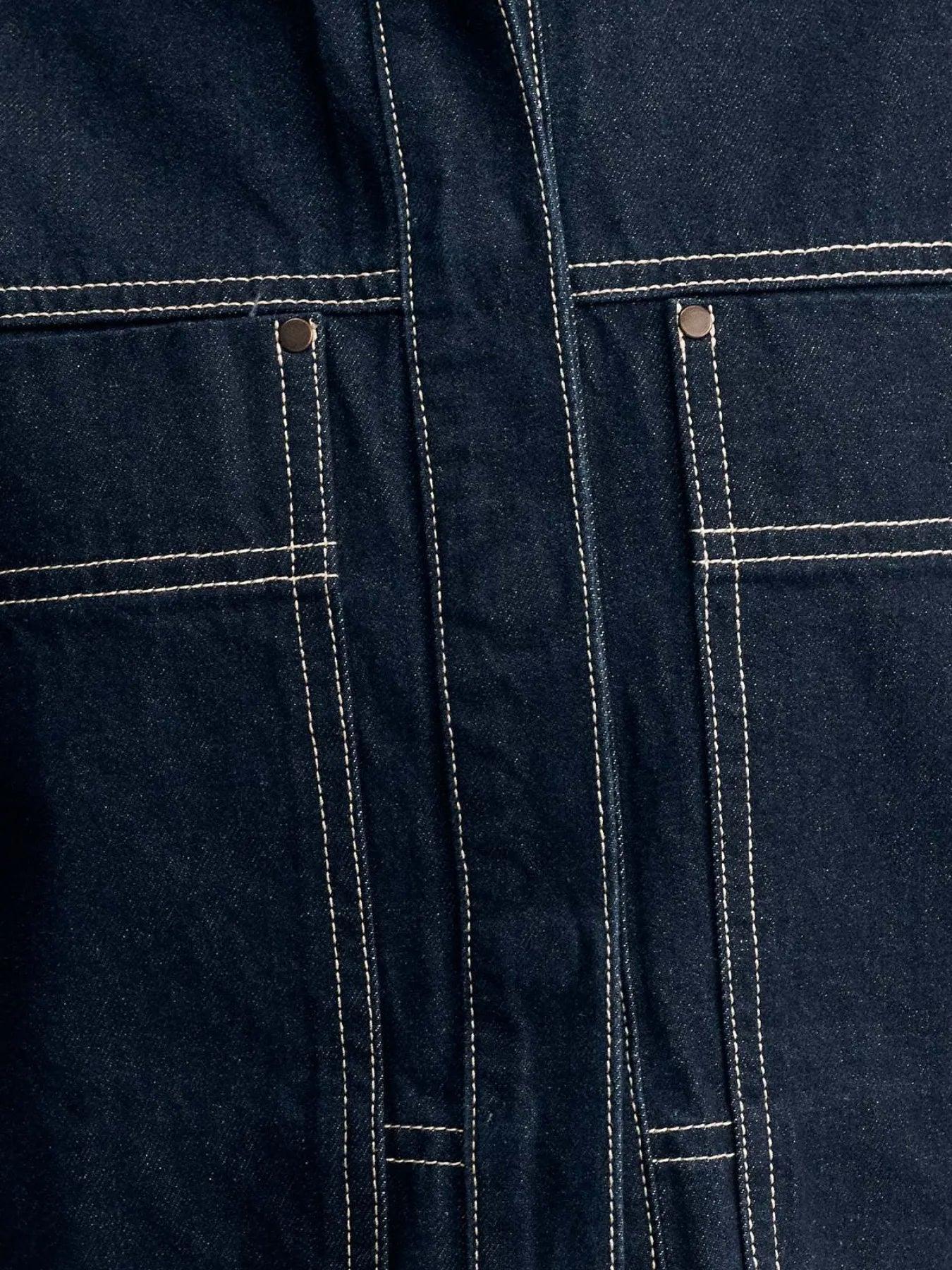 Midnight blue contrast-stitch denim top, side view showing the boxy drop-shoulder cut and cropped hem.