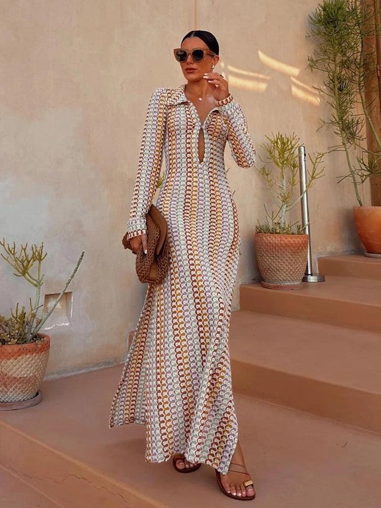 Multicolor crochet long-sleeve maxi cover-up dress, front view showing the plunging V-neck shawl lapel and bobble-stitch open crochet in pastel yellow, pink, cream, sage, and rust.