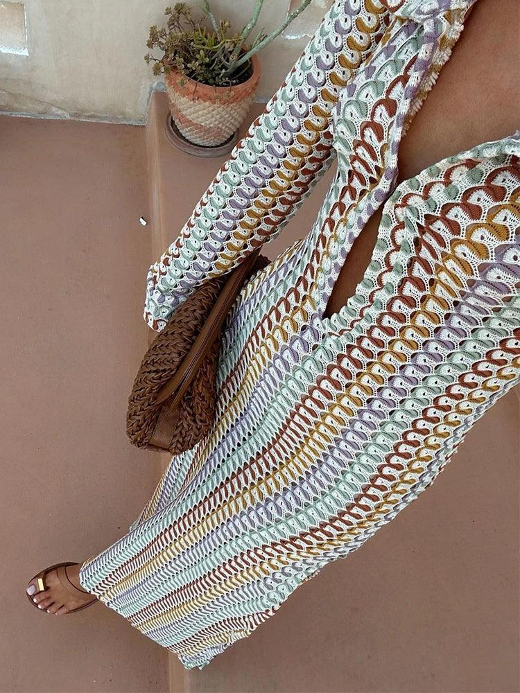 Multicolor crochet long-sleeve maxi cover-up, full-length view showing the floor-length sweep and open crochet texture.