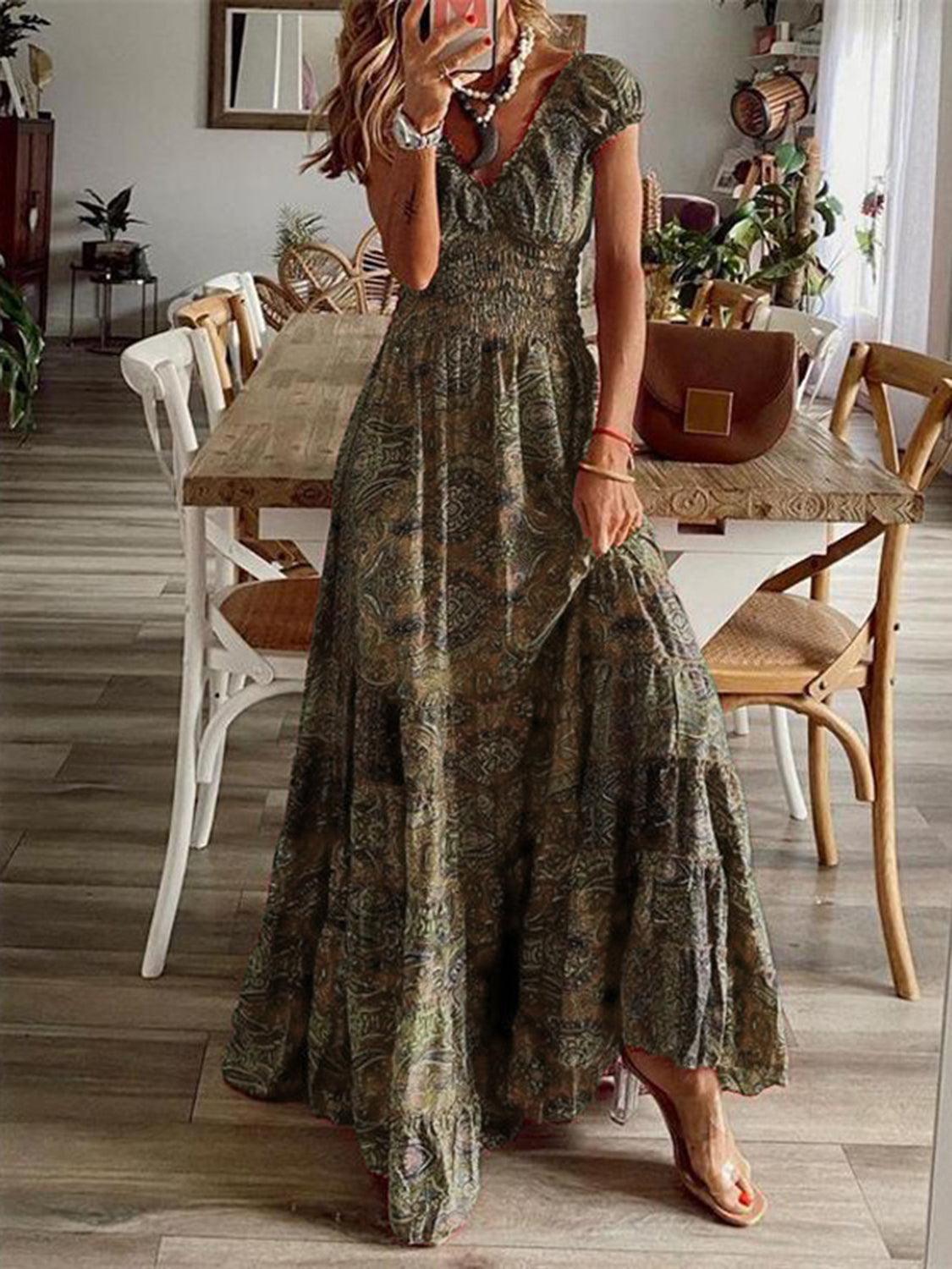 Olive paisley smocked maxi dress, full-length view showing the tiered floor-length skirt.