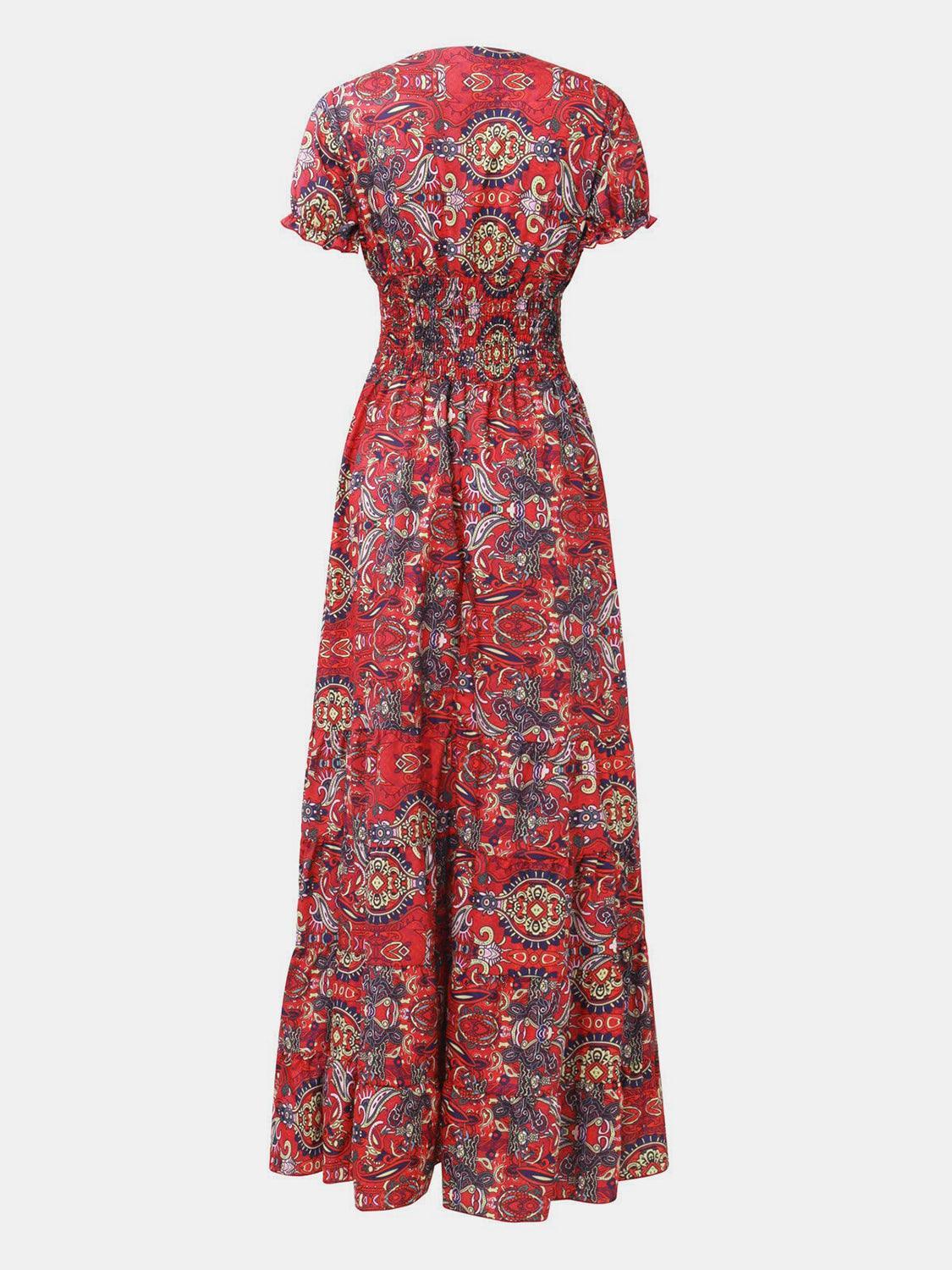 Purple paisley boho smocked maxi dress, mid-body view showing the tiered floor-length skirt and gathered cap sleeve.