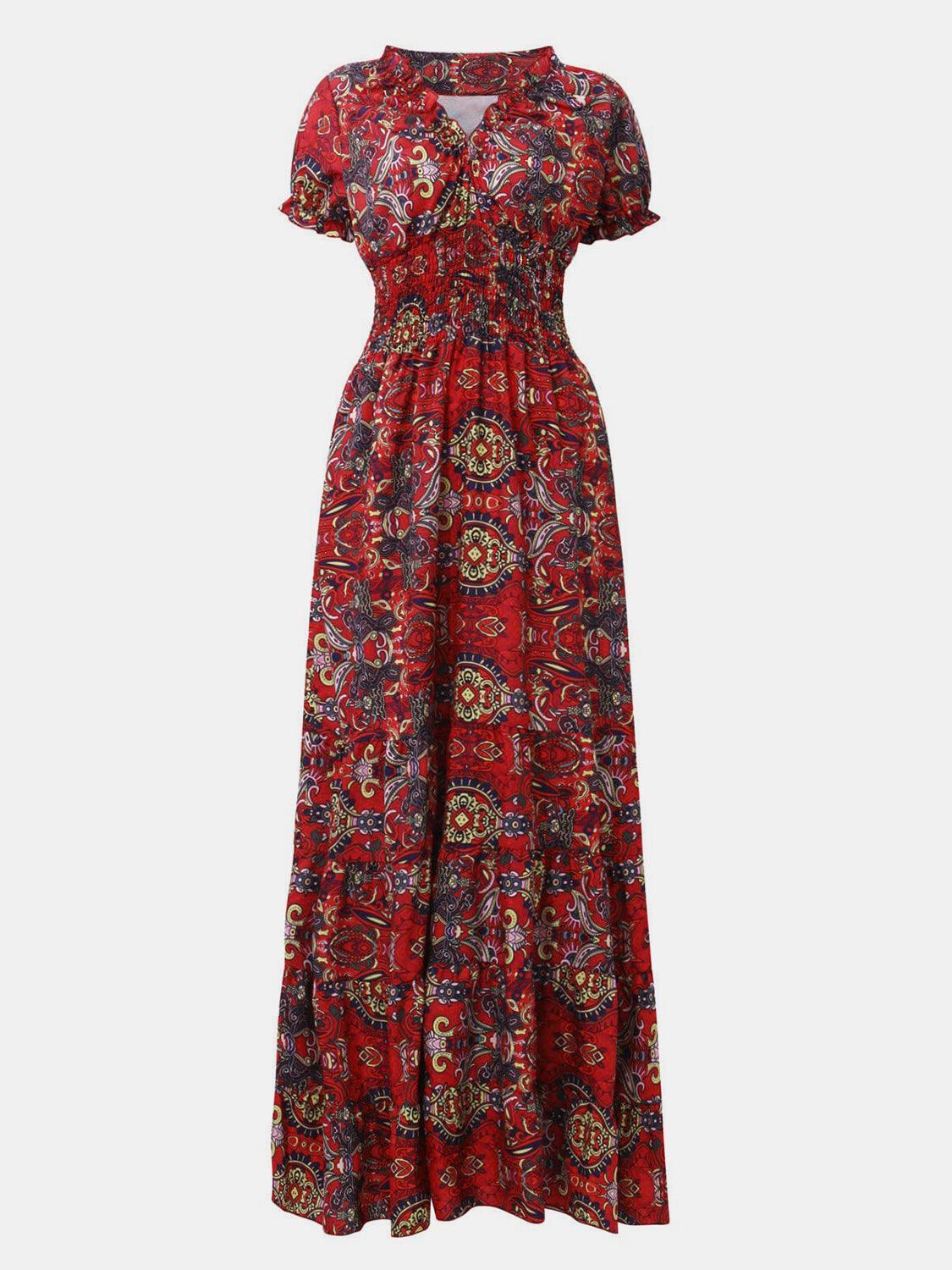 Purple paisley smocked V-neck short-sleeve maxi dress, front view showing the V-neckline and smocked bodice with tonal paisley print.
