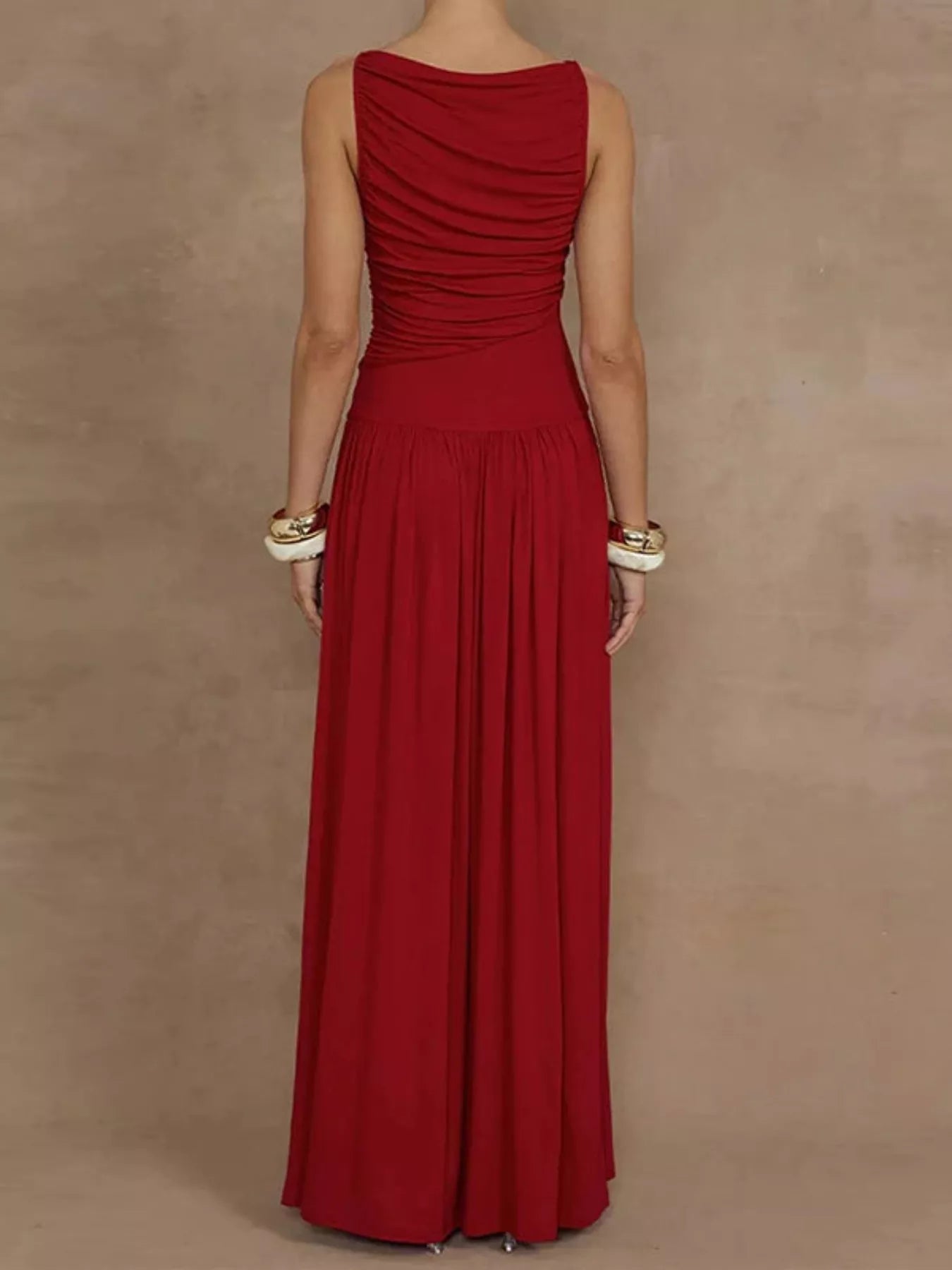 Red ruched sleeveless maxi dress, bodice detail showing the twisted ruching, high boat neckline, and clean-finished armholes.