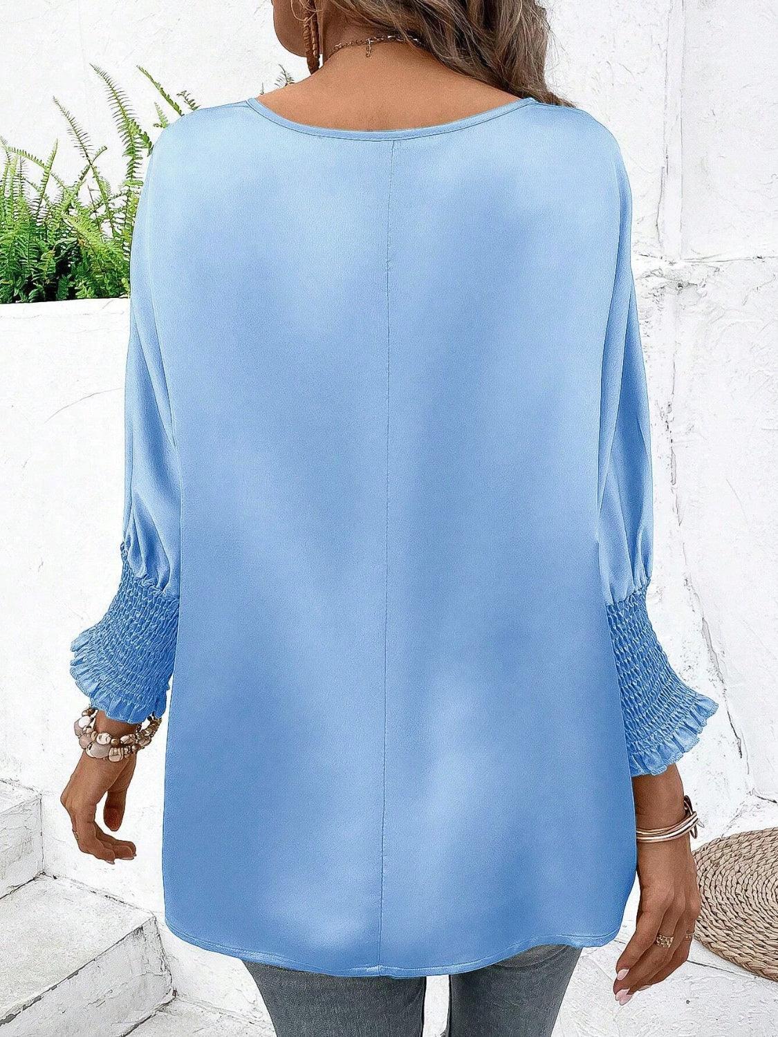 Satin Smocked Round Neck Three-Quarter Sleeve Top.