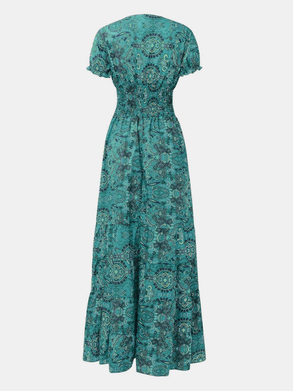 Turquoise paisley smocked maxi dress, full-length view showing the floor-length tiered skirt.