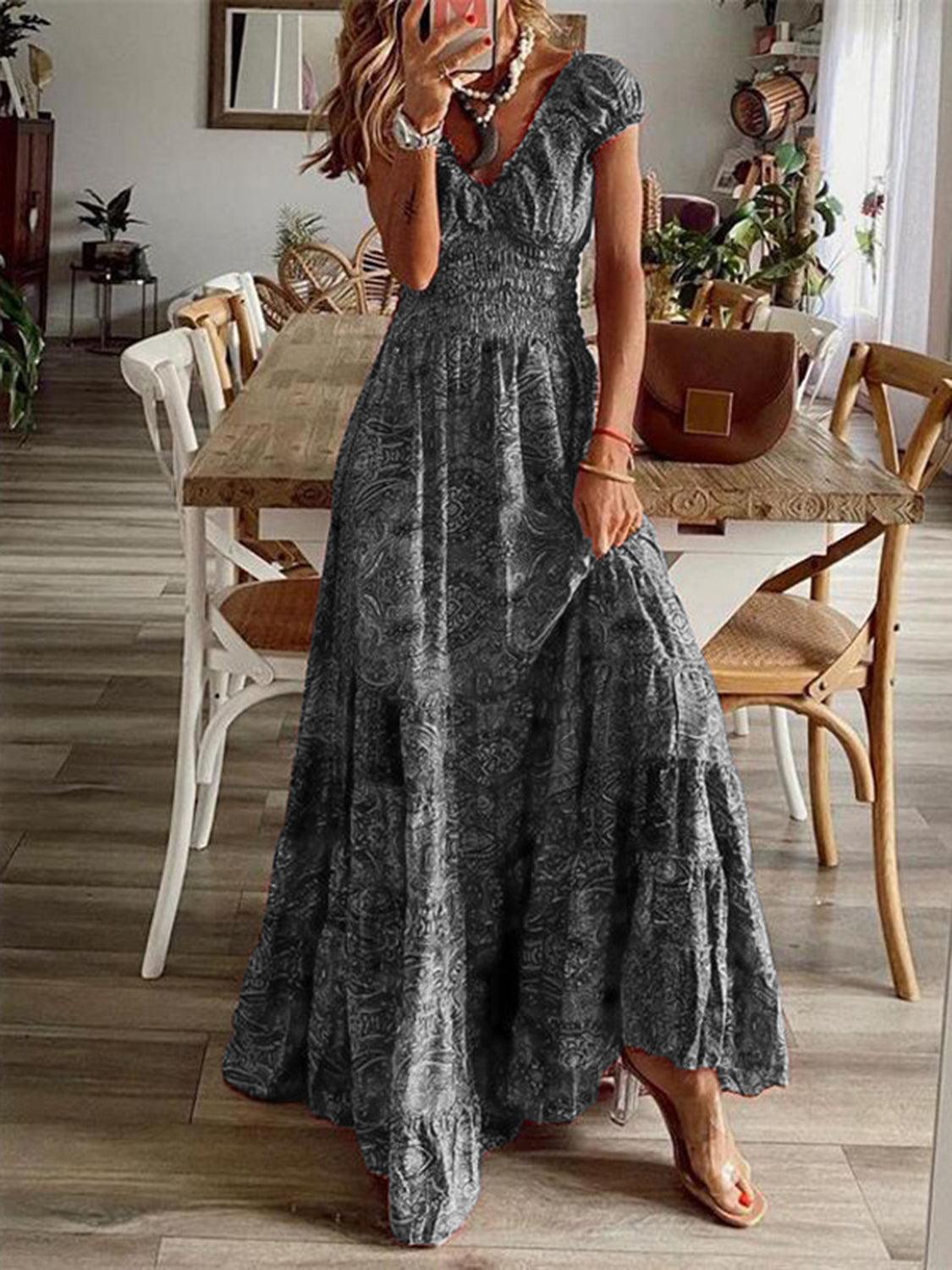 Turquoise paisley smocked V-neck short-sleeve maxi dress, front view showing the bohemian silhouette and tonal print.