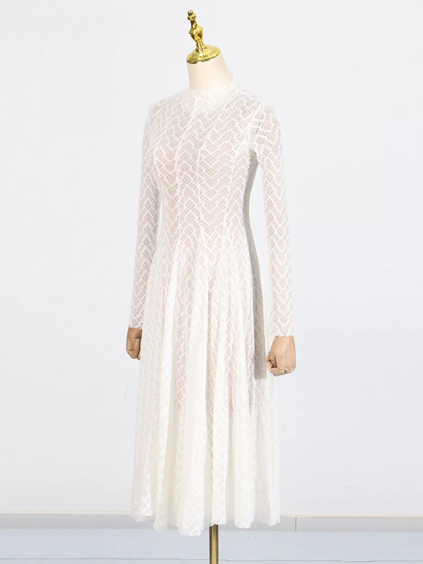 White lace mock-neck maxi dress, back view showing the concealed back zip closure and body-skimming silhouette.