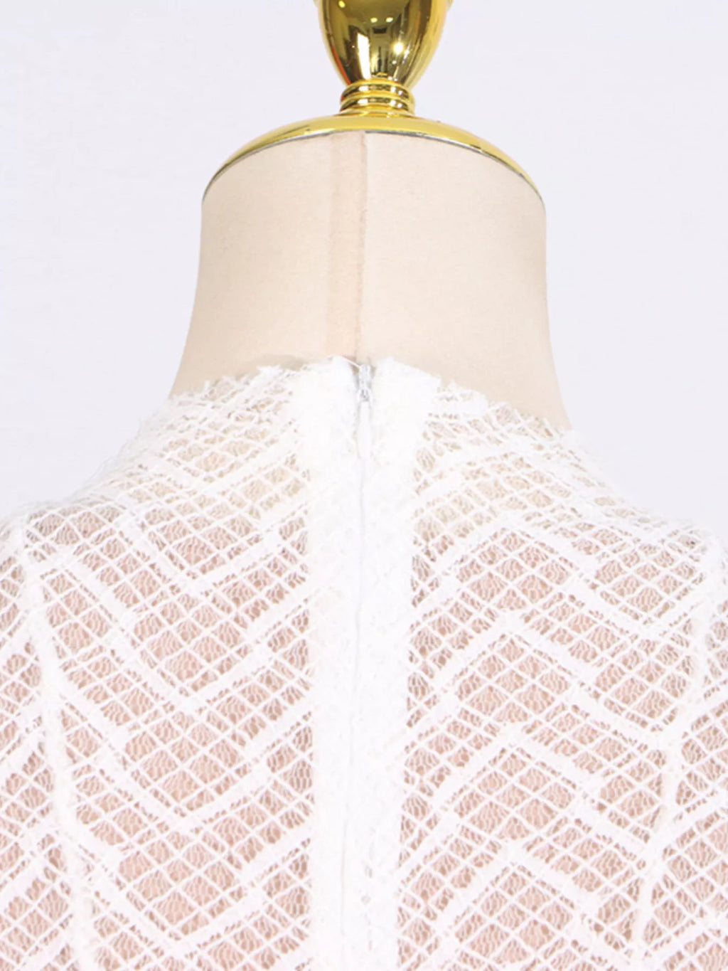 White textured-lace long-sleeve maxi dress, full-length view showing the floor-length silhouette and open-knit texture.