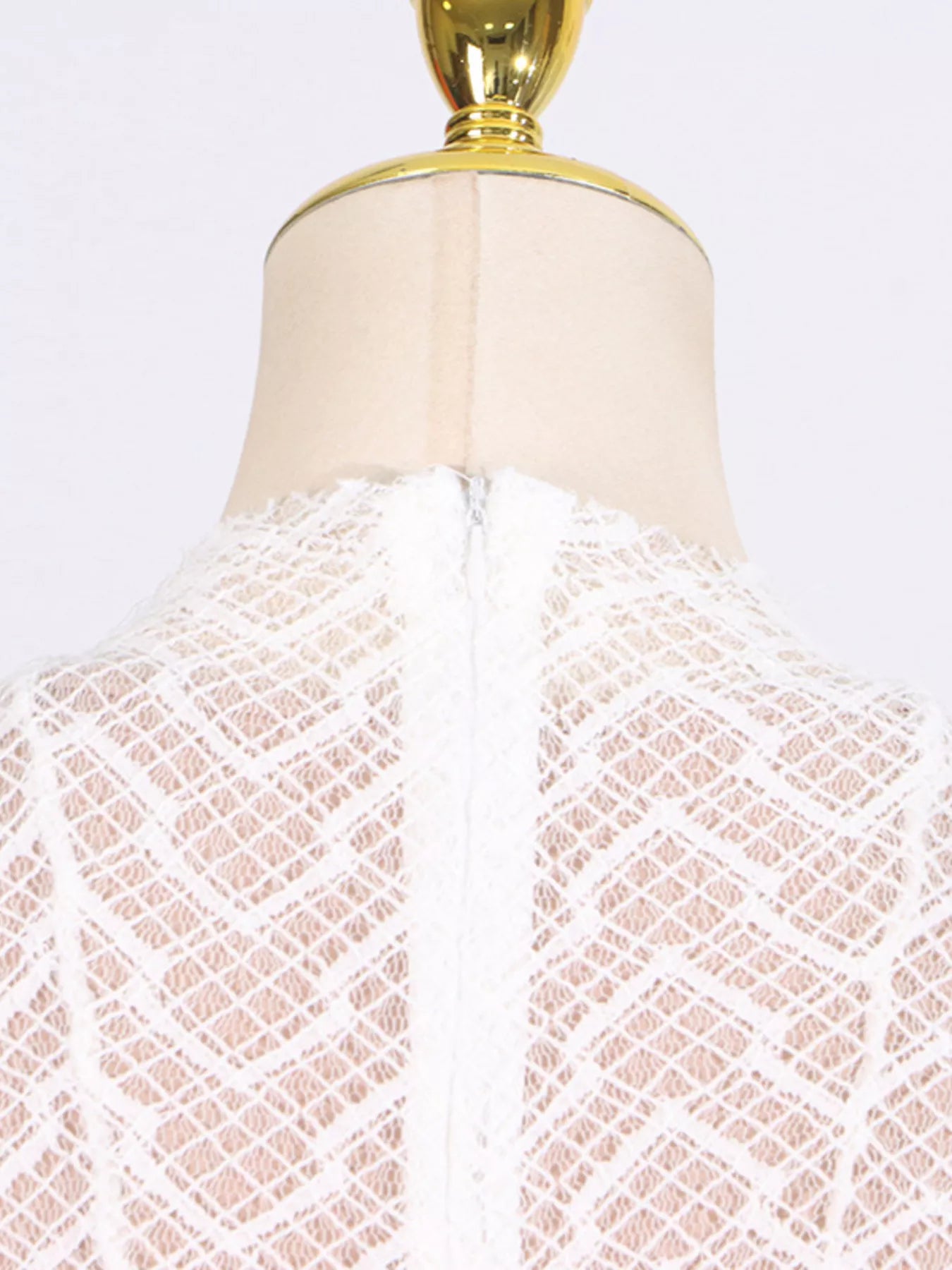 White textured-lace long-sleeve maxi dress, full-length view showing the floor-length silhouette and open-knit texture.