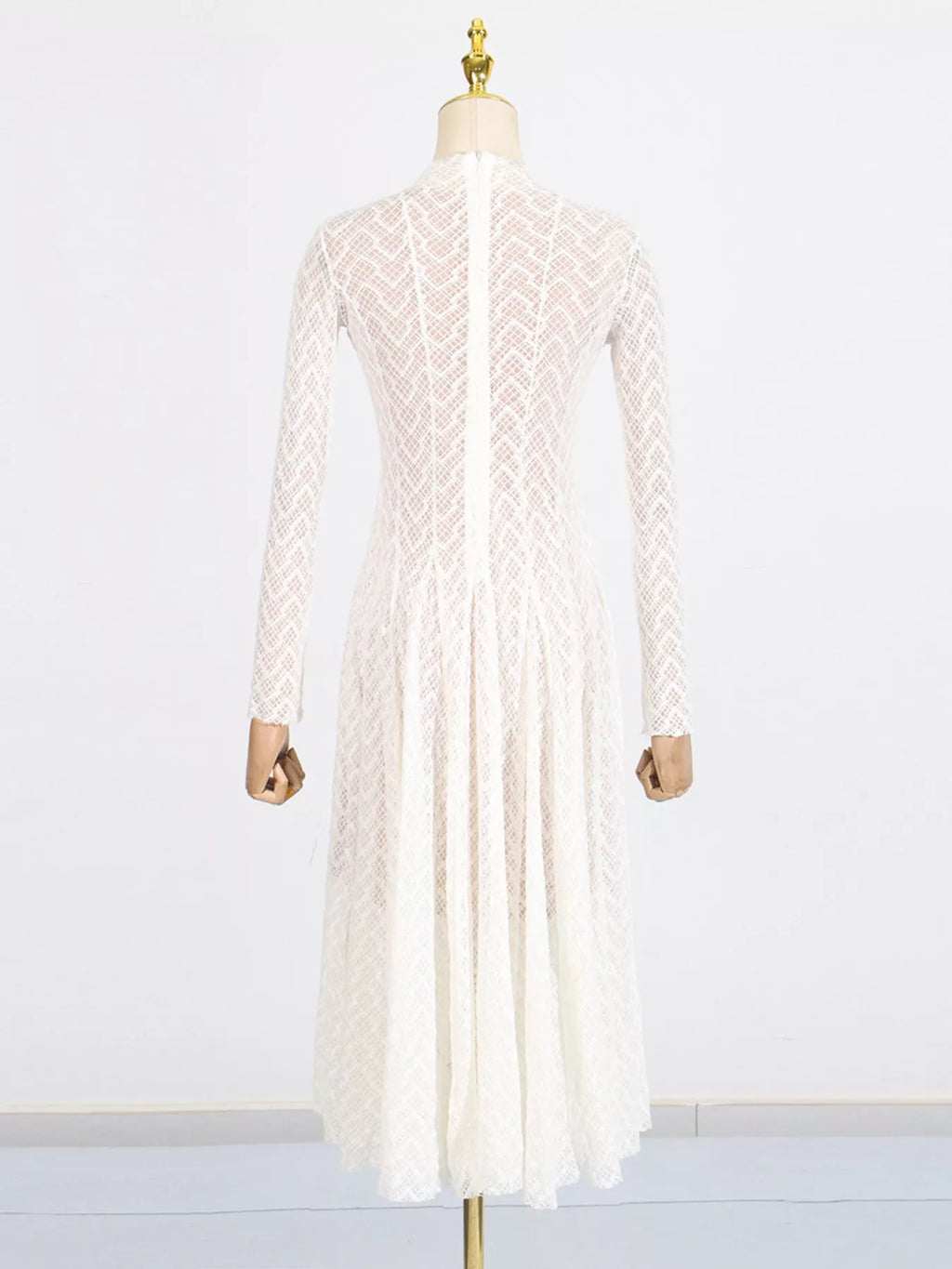 White textured-lace mock-neck maxi dress, mid-body view showing the open-knit lace ladder-stripe texture.